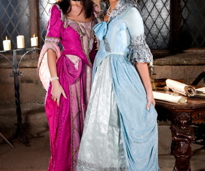Teen girls don period clothing prior to a threesome in a medieval building