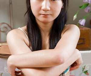 Cute consolidated knocker Asian amateur Oksana promulgation her hairy twat