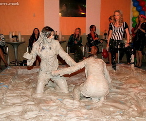 Seductive fetish ladies get involved in fully clothed mud wrestling