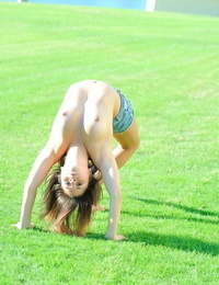 Flexible teen performs topless gymnastics at a park before going naked indoors