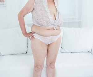 Very old granny Sila lets those massive naturals out and poses naked