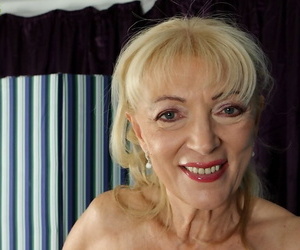 Blonde granny Janet Lesley exposes saggy boobs before spreading shaved twat