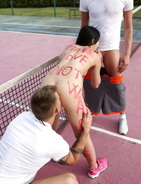 Teen slut Lady D gives two boys blowjobs outdoors on tennis court