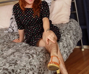 Hirsute model Velma posing hairy legs in heels and spreading beaver