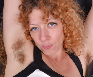 Grown-up redhead encircling snug tits window-dressing hairy underarms and vagina