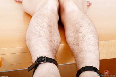 Older solo model Simone Delilah showing off her hirsute body parts in heels