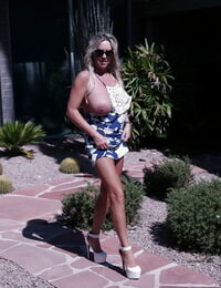 Large breasted housewife Sandra Otterson flashing outdoors in skirt