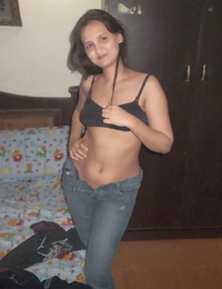 Hot Indian model in tight jeans posing seductively in sexy lace bra