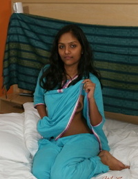 Hot Indian slut Divya removes her shirt to show her big dark nipples