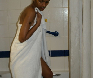 Desi arch timer strips in the altogether for a shower before drying herself yon a towel