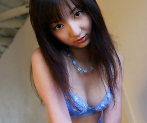 Seductive asian babe with neat fanny slowly slipping off her clothes