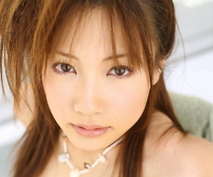 Adorable Japanese teen Reika Shiina poses clothed and naked during solo action