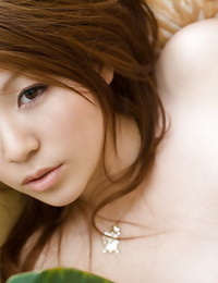 Seductive oriental youthful model Rina Koizumi slipping off her sexy pants