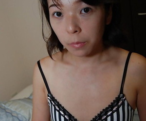 Shy asian MILF with tiny tits getting nude and vibing her shaved gash