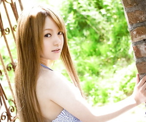 Stunning asian babe Ria Sakurai uncovering her graceful body outdoor
