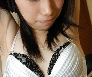 Cute asian babe Chiharu Moriya getting naked and rubbing her clit