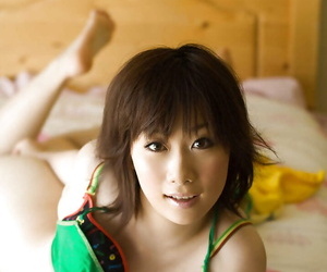 Full-bosomed asian coed Hanano Nono stripping off her underwear on the bed