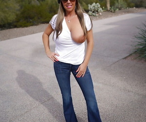 Blond housewife Sandra Otterson modeling sunglasses and jeans for babe pics