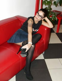 Nerdy playgirl Chiara posing thoroughly covered on mattress in  and glasses