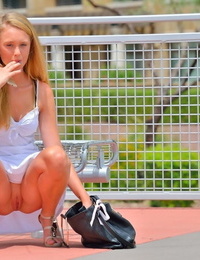 Stunning legal age teenager accepts aroused at flashing her uncovered uterus in public places