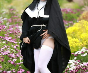 Redheaded nun Penny Pax shows off her big natural boobs together with and twat