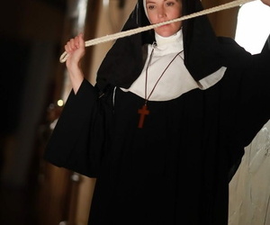 American nun Mona Wales prays be useful to forgiveness before posing in the naked