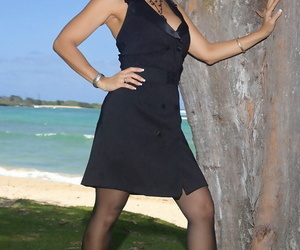 Distress legged adult Roni posing on someone\'s skin beach alongside starless lacy pantyhose