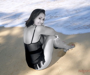 Distress legged adult Roni posing on someone\'s skin beach alongside starless lacy pantyhose