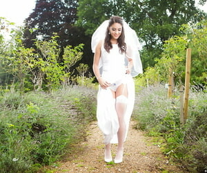 Newly married bride Carolina Abril posing out of the closet round wedding apparel