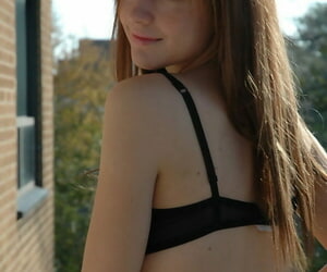 Untrained teen steps extensively visage her cell balcony in the matter of her bra added to shorts