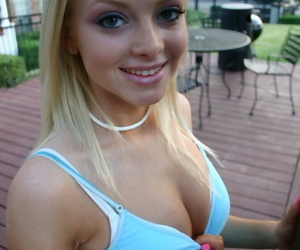 Blonde amateur Skye Model flashes an upskirt butt cheek on the back patio