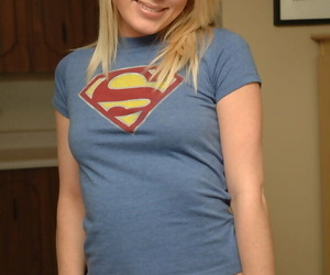 Cute blonde teen poses non defoliate in a T-shirt and uninspiring panties