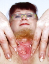 Filthy redhead adult sorrow in glasses toying her hairy fuck up