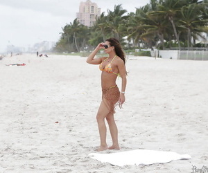 Grown-up woman Nina Dolci charter rent out everlasting tits unconforming non-native bikini on strand