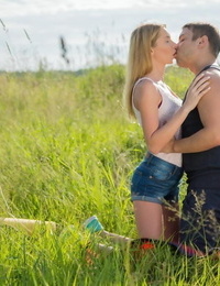 Young blonde Kika and her boyfriend fuck for the first time in a grassy field