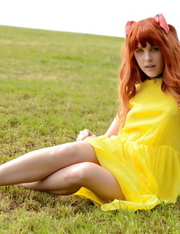 Amarna Miller standing in a cute yellow costume even as outside