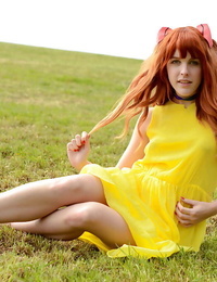 Amarna Miller standing in a cute yellow costume even as outside