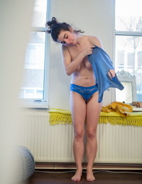 Nude amateur Livia V is secretly filmed getting dressed by a hidden camera