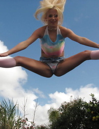 18 year old blonde Halie Cummings baring big boobs on trampoline outdoors