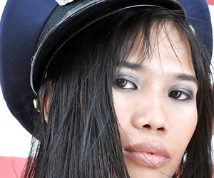 Gorgeous inferior Asian Anne poses in the remarkable police uniform