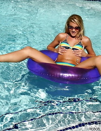 While in the pool slutty milf Samantha Ryan plays with her slender body