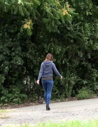 Naughty chick Teresa Bizarre pulls down her jeans and squats for a pee on curb