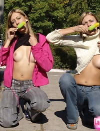 Teen lesbians head to a public park to flash their boobs and bums