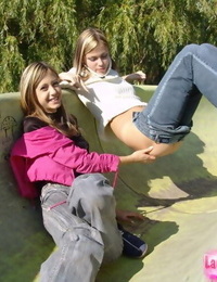 Young lesbian chicks head to a public park to split second their front bumpers and bums