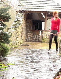 Redhead Sandra lifts her short skirt to take a fancy sticky pee in public