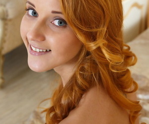 Redhead glamour babe Roberta Berti spreading shaved teen vagina