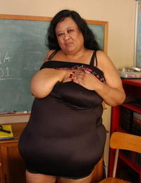 SSBBW mentor Debrina letting her massive saggy tits loose in classroom