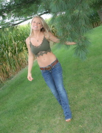 Hot MILF Madden removes her jeans in the backyard to tease in thong underclothes