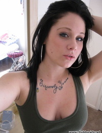 Dark haired amateur pulls out her big naturals and licks her nips in selfies