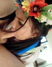 Oriental female wears flowers in her hair while POV fucking action with a tourist